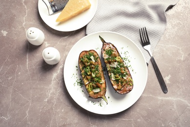 Photo of Flat lay composition with plate of stuffed eggplants on gray table