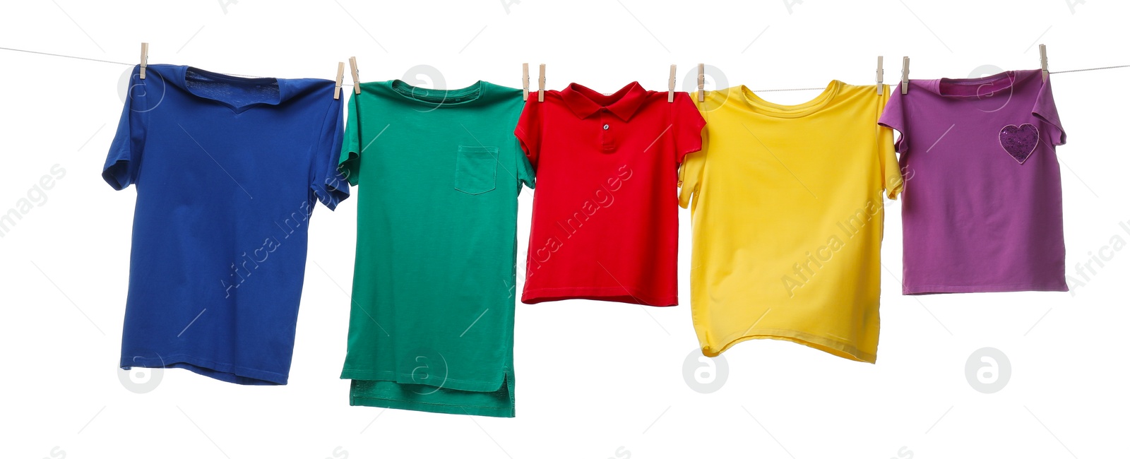 Photo of Colorful t-shirts drying on washing line isolated on white