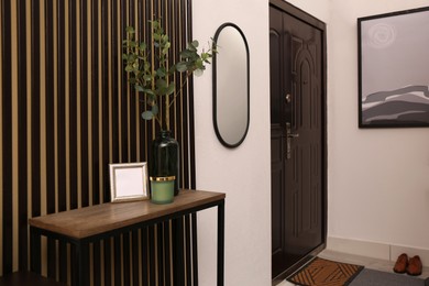 Photo of Modern hallway interior with console table and mirror