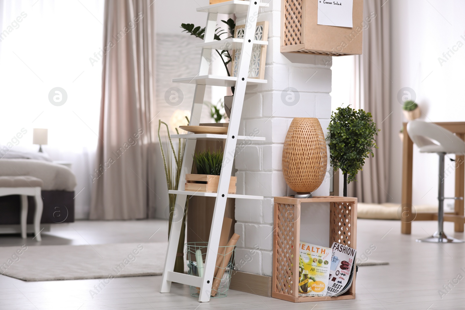 Photo of Modern eco style interior with wooden crates and shelves