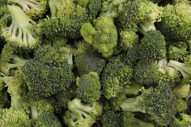 Fresh raw broccoli as background, top view