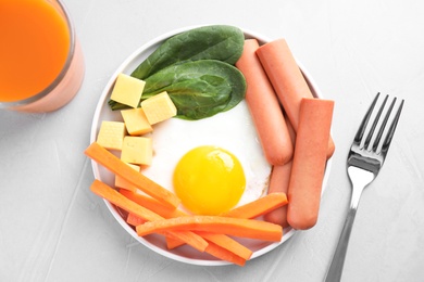 Flat lay composition with and cheese egg on light grey table. Breakfast for kids