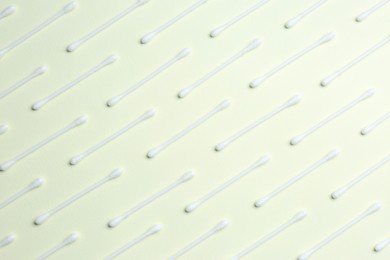 Photo of Many cotton buds on beige background, flat lay