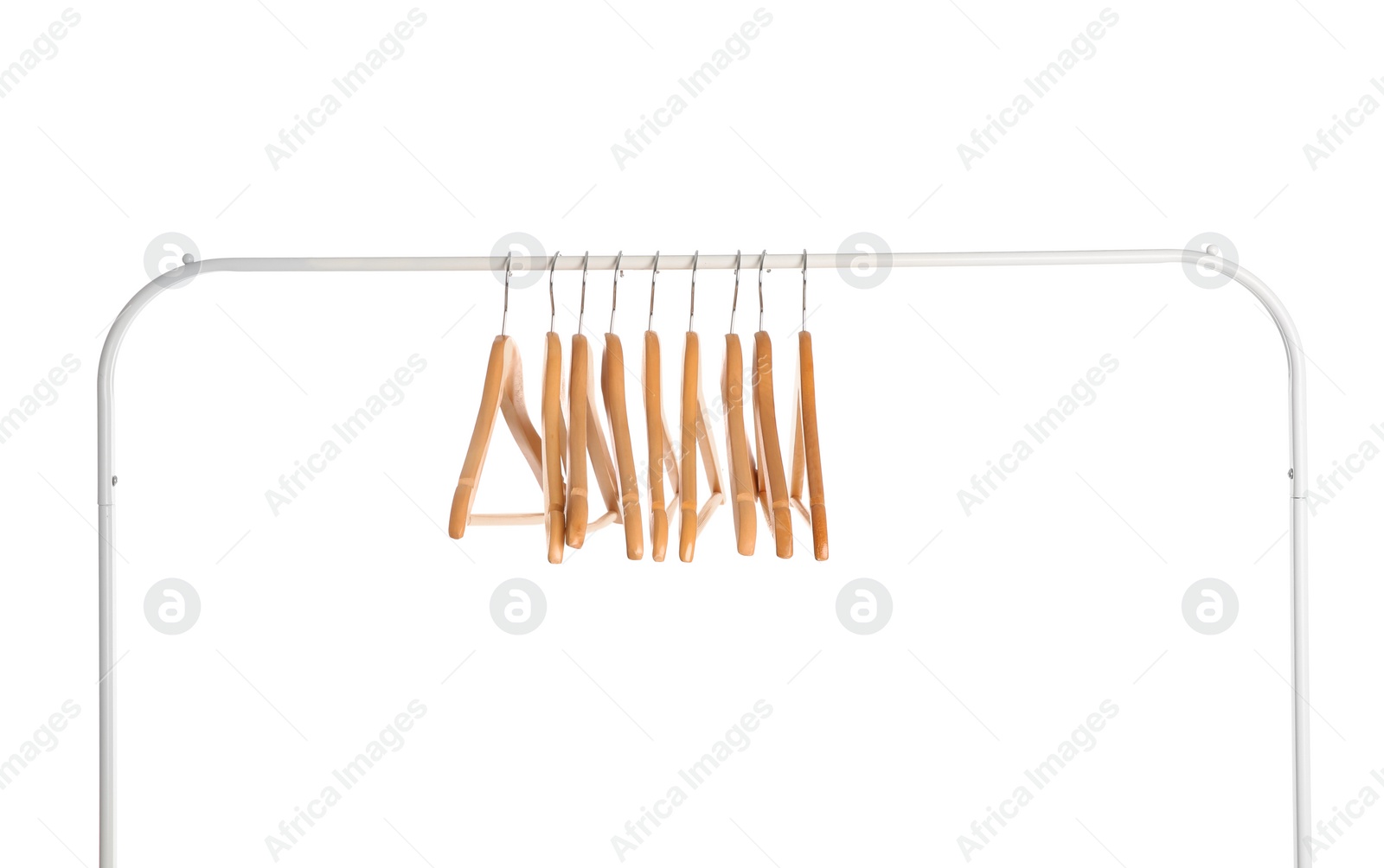 Photo of Wardrobe rack with wooden hangers isolated on white