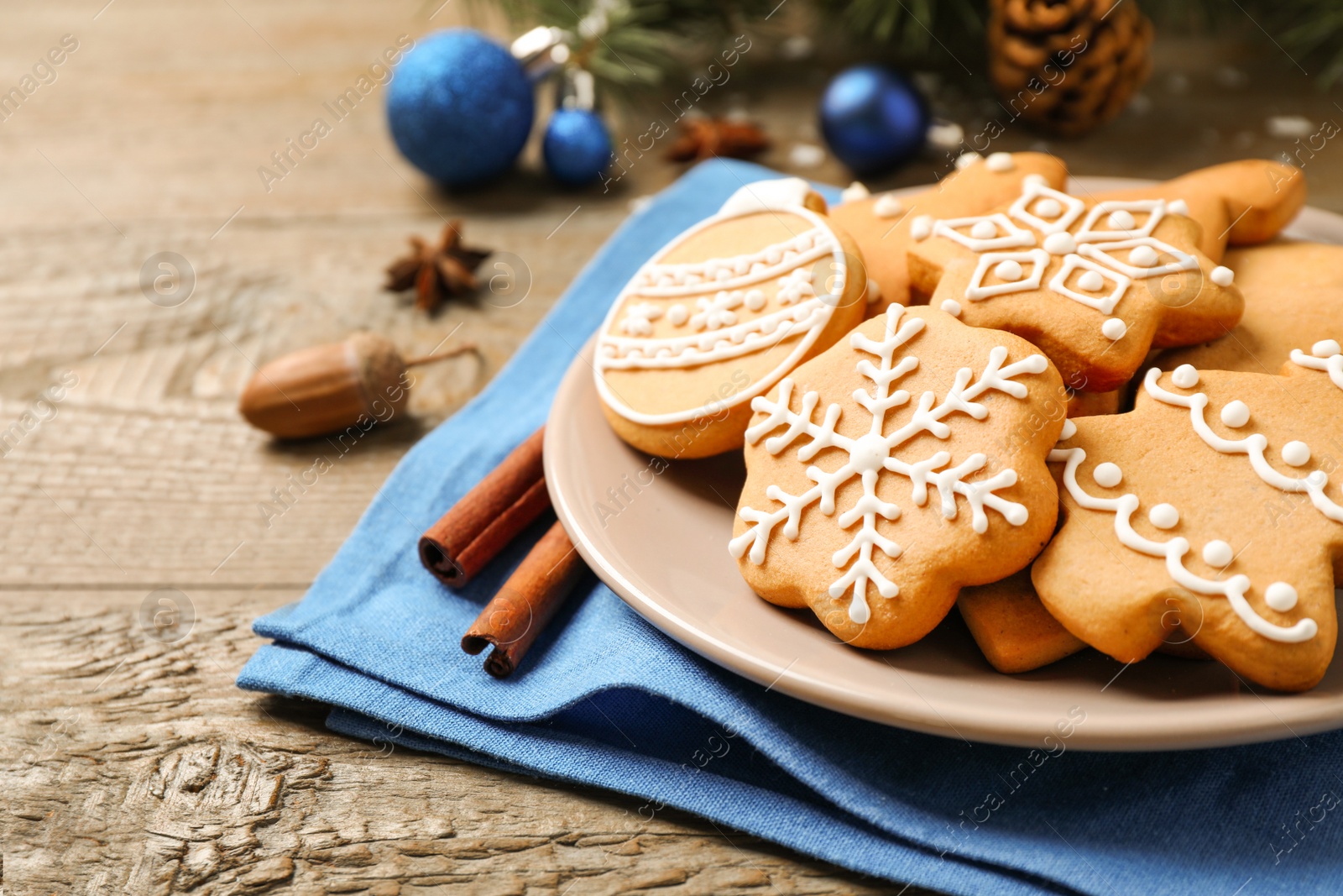 Photo of Tasty homemade Christmas cookies on wooden table, closeup