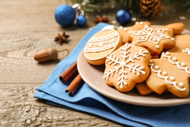 Photo of Tasty homemade Christmas cookies on wooden table, closeup