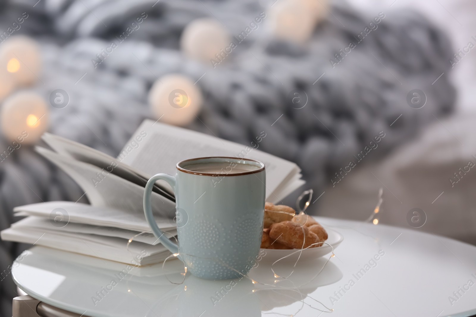 Photo of Cup of coffee and plate with croissants  on table