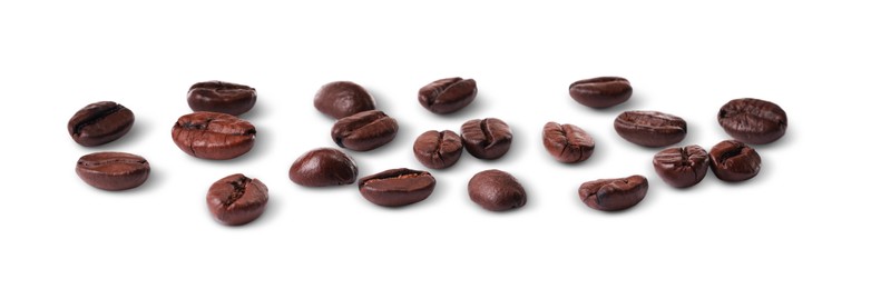 Photo of Many roasted coffee beans isolated on white