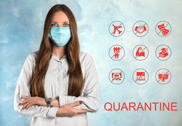 Woman with surgical mask against light blue background. Hold on quarantine rules during coronavirus outbreak