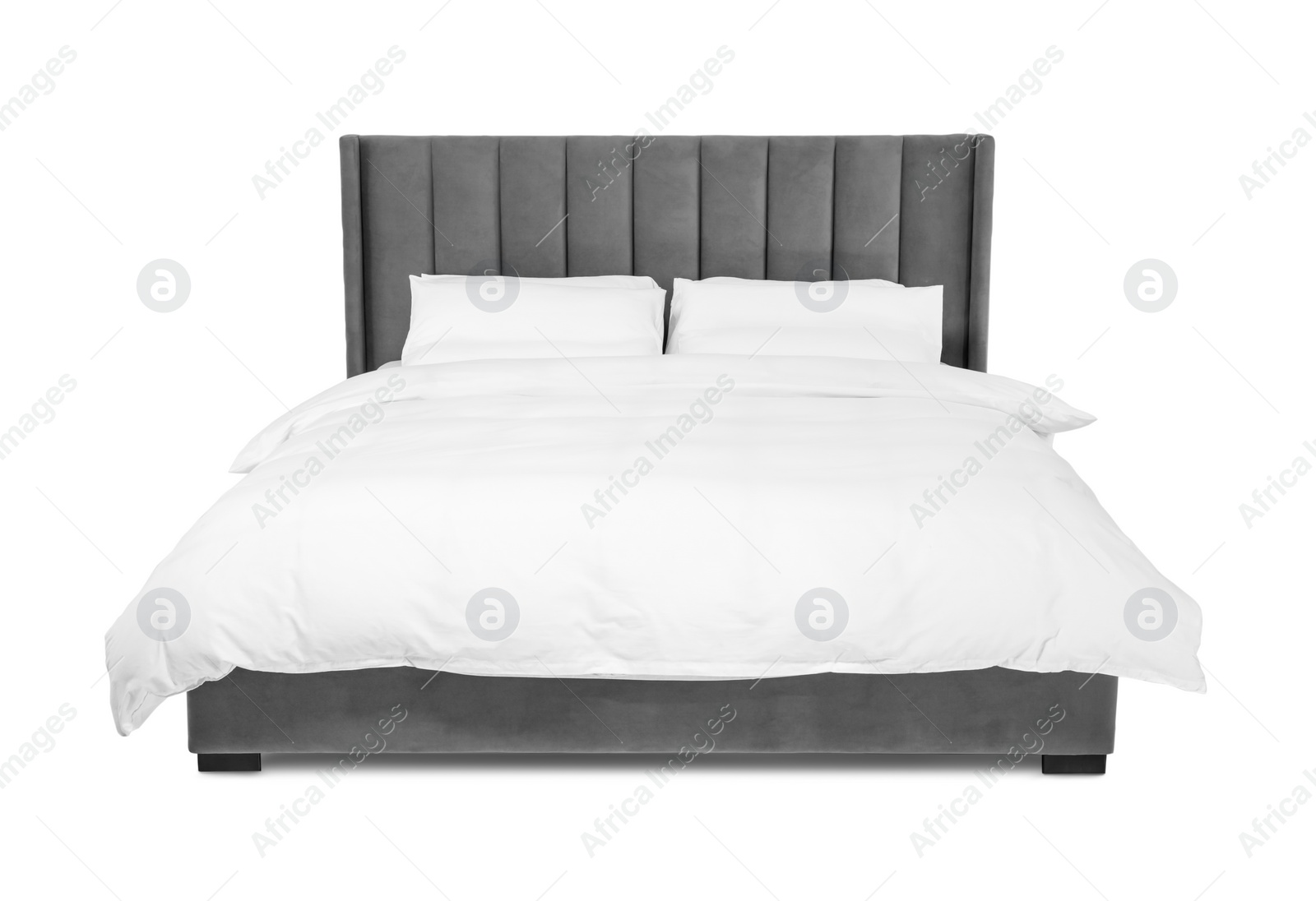 Photo of Comfortable gray bed with linens on white background