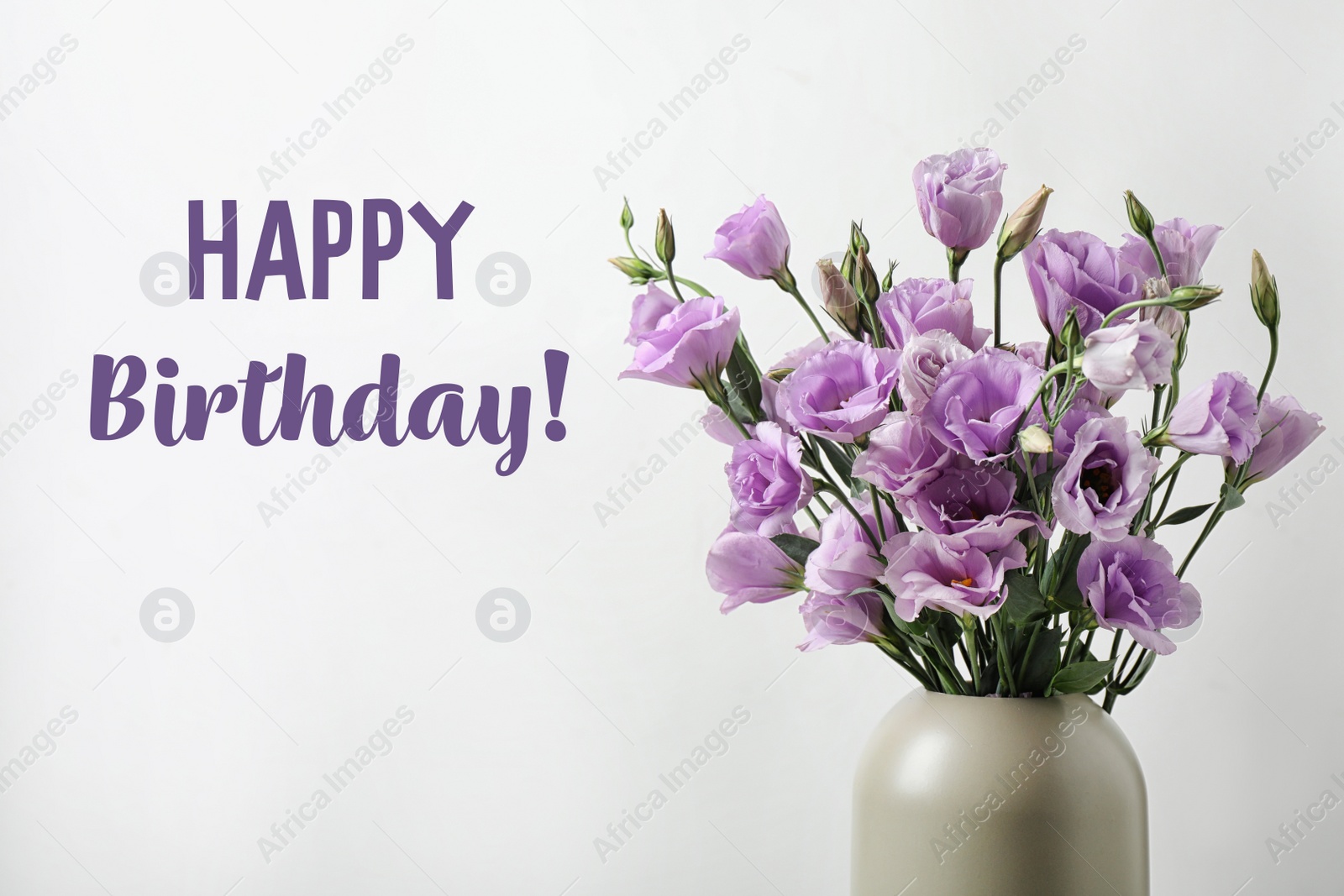Image of Happy Birthday! Beautiful violet flowers in vase on light background