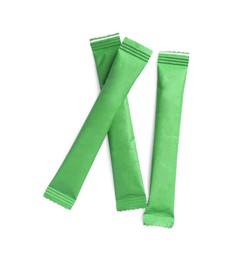 Photo of Green sticks of sugar on white background, top view