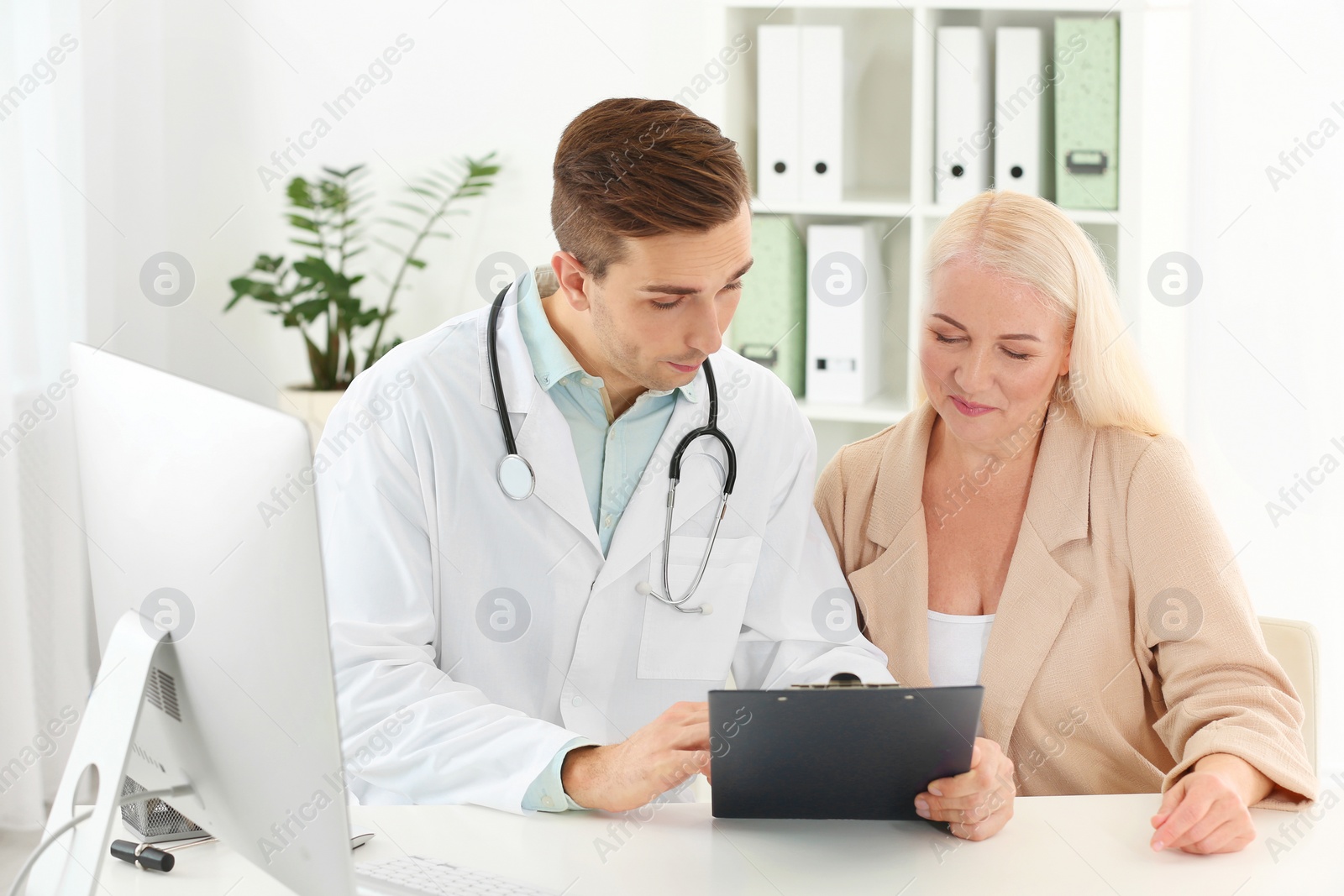 Photo of Doctor working with mature patient in hospital