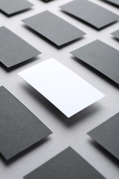 Photo of Blank business cards on light grey background. Mockup for design