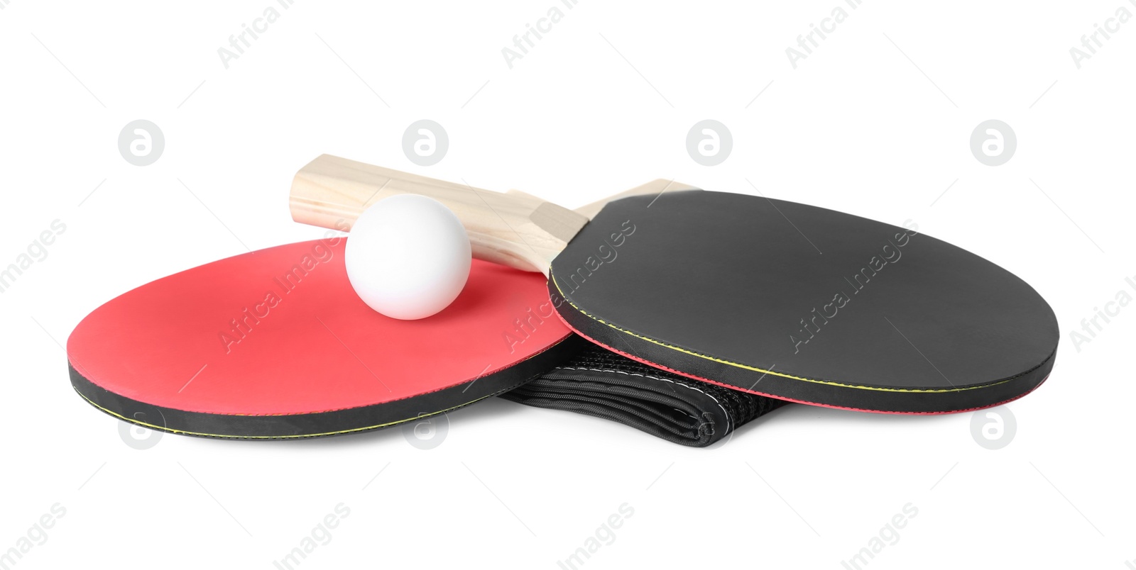 Photo of Ping pong rackets, net and ball isolated on white