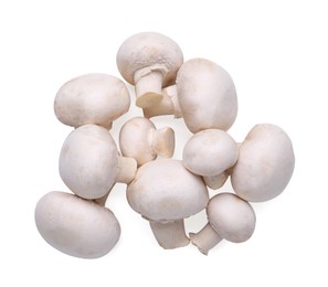 Photo of Many fresh champignon mushrooms isolated on white, top view