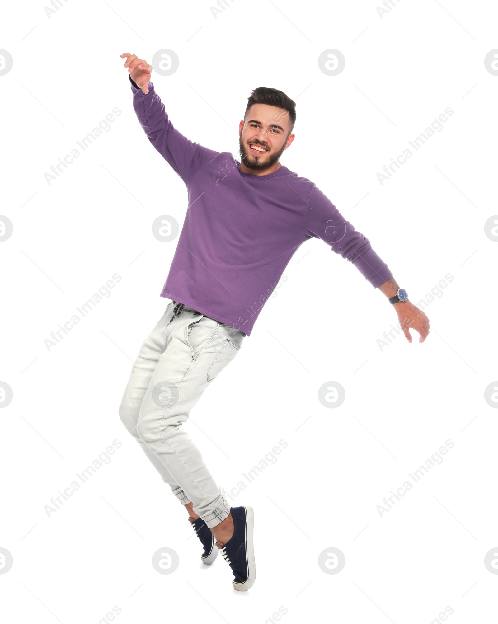 Photo of Handsome young man posing on white background