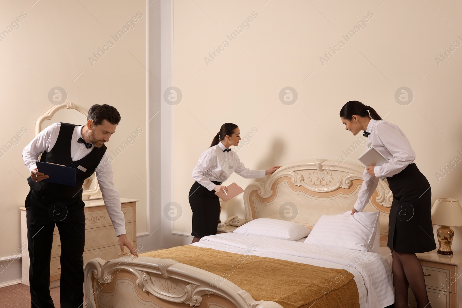 Photo of Group of people attending professional butler courses in hotel