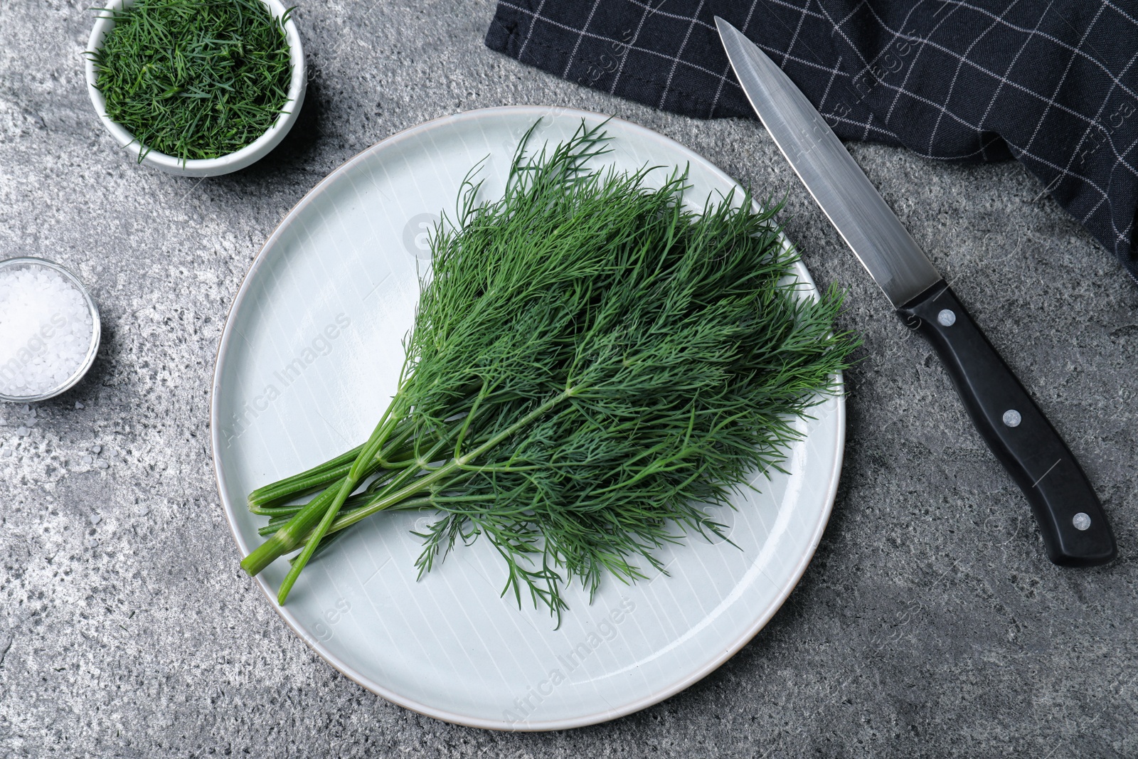 Photo of Flat lay composition with fresh dill on grey table