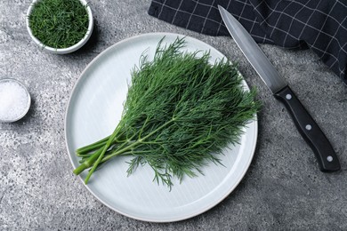 Flat lay composition with fresh dill on grey table