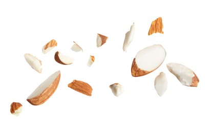 Photo of Pieces of tasty almonds on white background