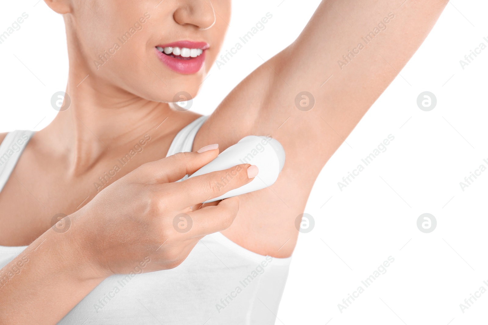 Photo of Young woman using deodorant on white background, closeup