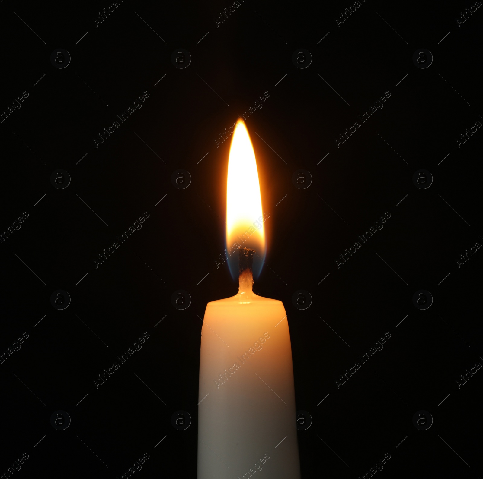 Photo of Burning candle on dark background. Symbol of sorrow