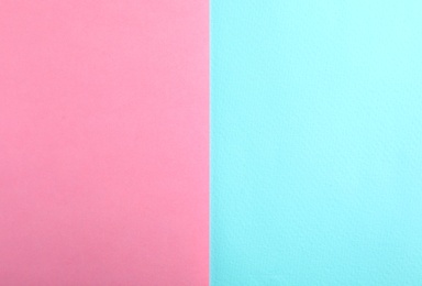 Photo of Blue and pink paper sheets as colorful background, top view