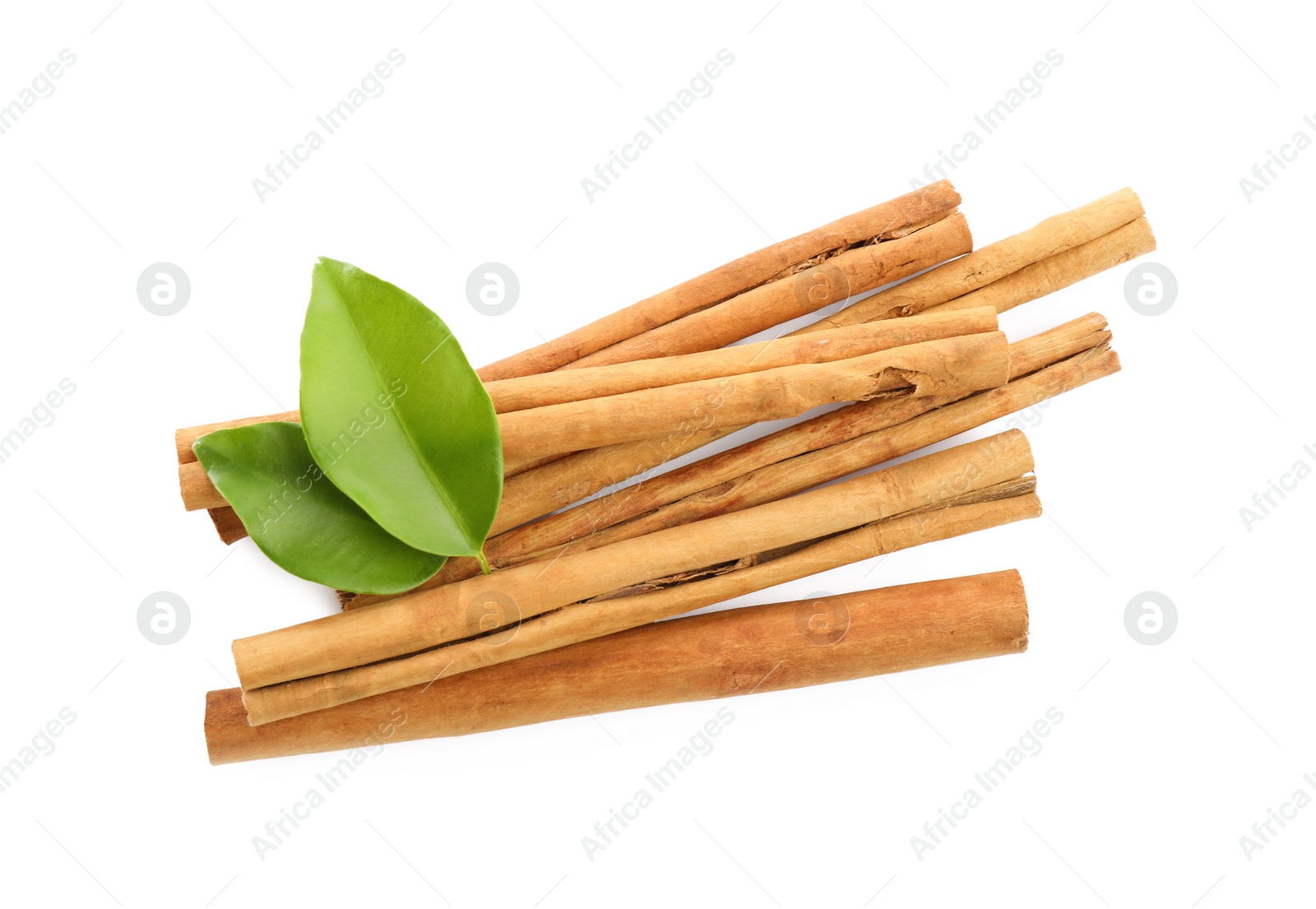 Photo of Aromatic dry cinnamon sticks and green leaves on white background, top view