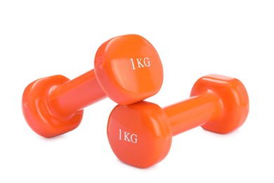 Photo of Orange dumbbells isolated on white. Sports equipment