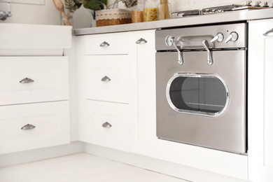 New modern oven in stylish kitchen. Cooking appliance