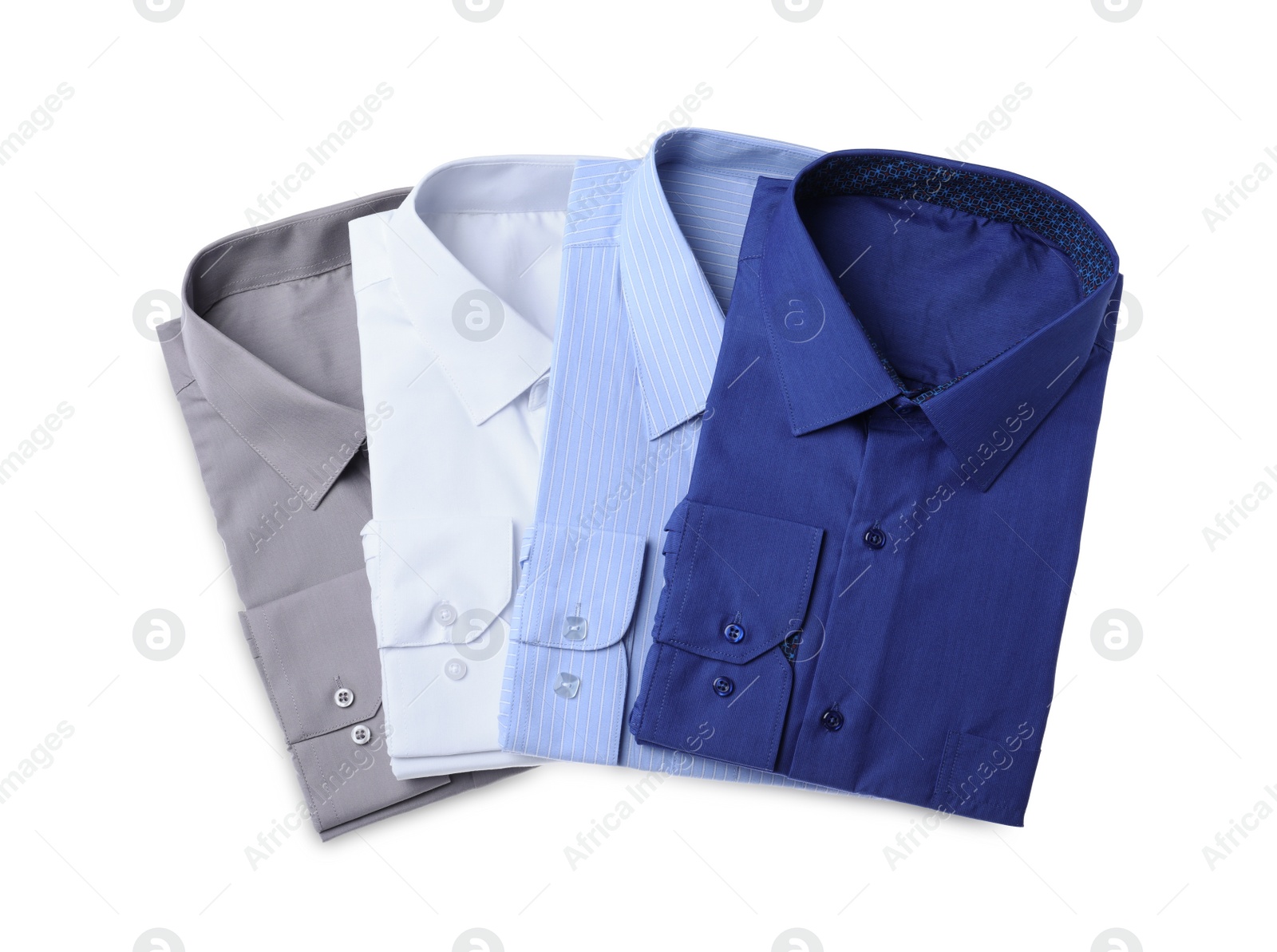 Photo of Stylish shirts isolated on white, top view. Dry-cleaning service