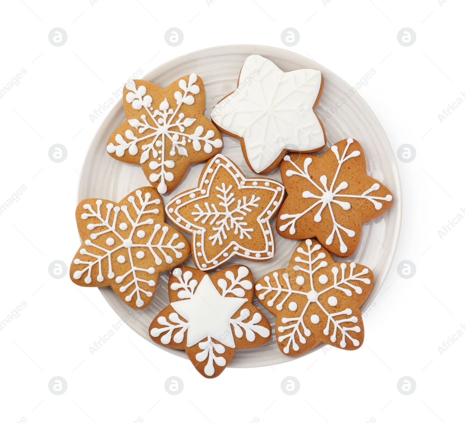 Photo of Tasty star shaped Christmas cookies with icing isolated on white, top view