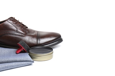 Stylish men's footwear and shoe care accessories on white background, closeup