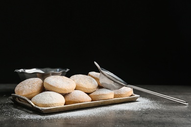 Photo of Tray of traditional cookies for Islamic holidays and strainer on table. Eid Mubarak