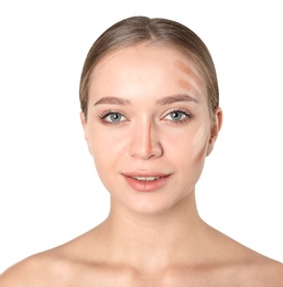 Portrait of beautiful young woman with makeup contouring smears on face against white background