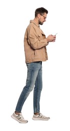 Photo of Man using smartphone while walking on white background