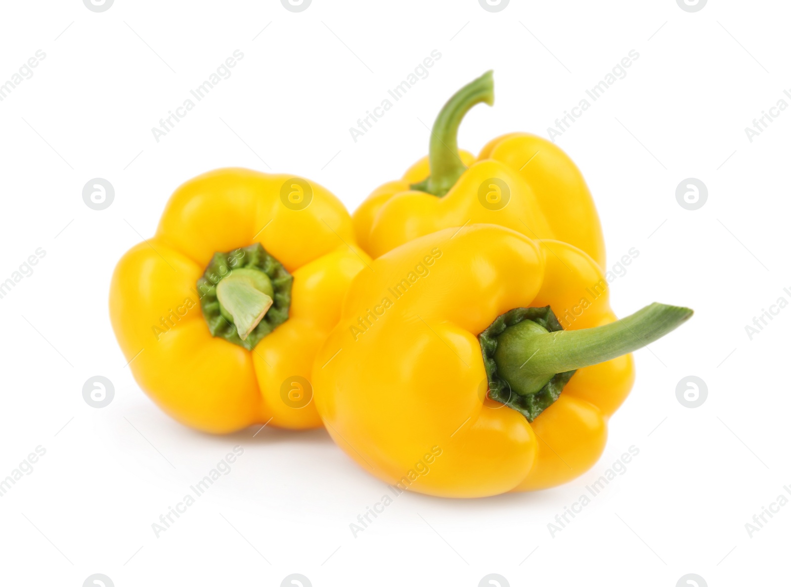 Photo of Ripe yellow bell peppers isolated on white