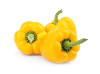 Photo of Ripe yellow bell peppers isolated on white