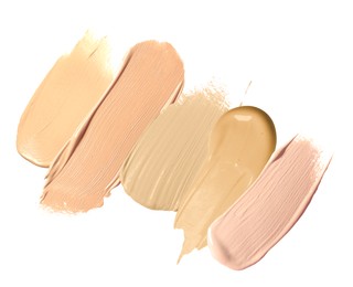 Image of Foundation of various shades for different skin tones isolated on white, top view. Set of samples