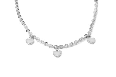 Photo of One metal chain with heart pendants isolated on white. Luxury jewelry
