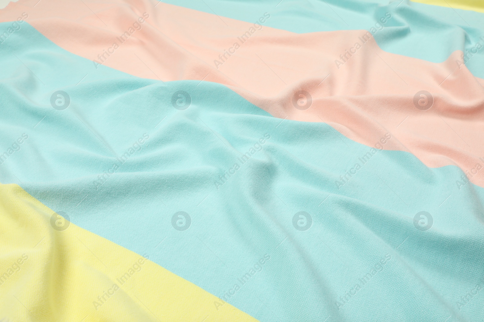 Photo of Crumpled colorful beach towel as background, closeup view