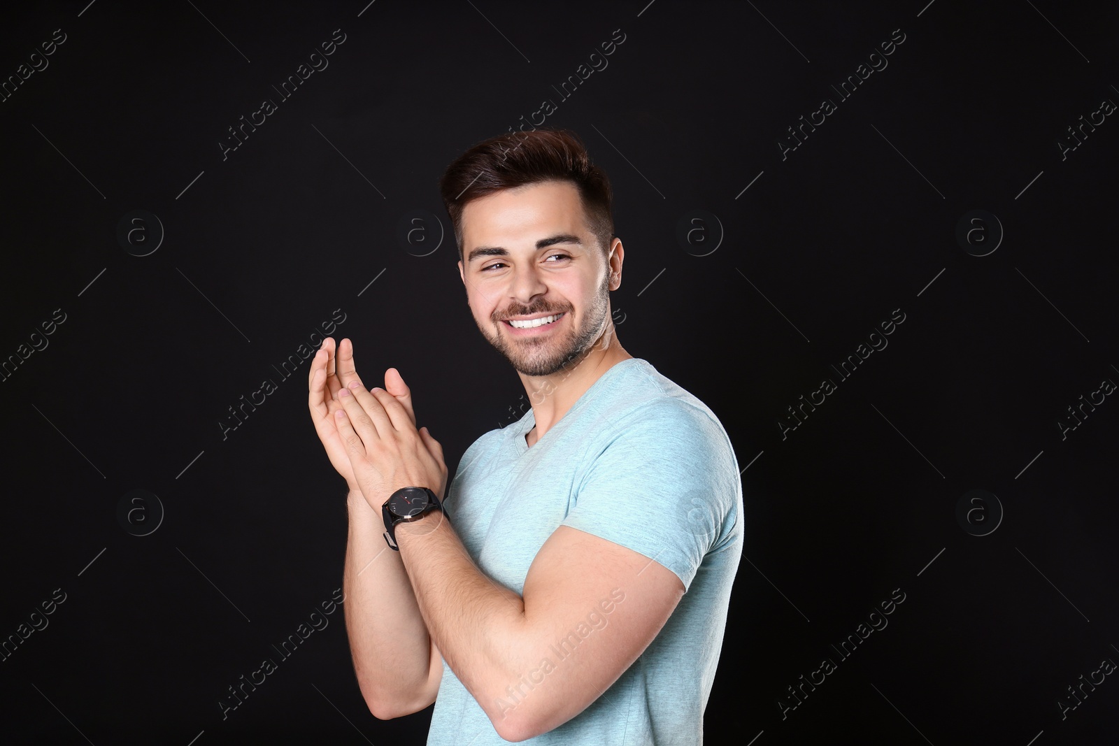 Photo of Portrait of handsome man on black background