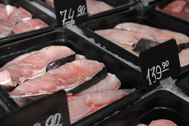Steaks of fresh fish in supermarket, closeup