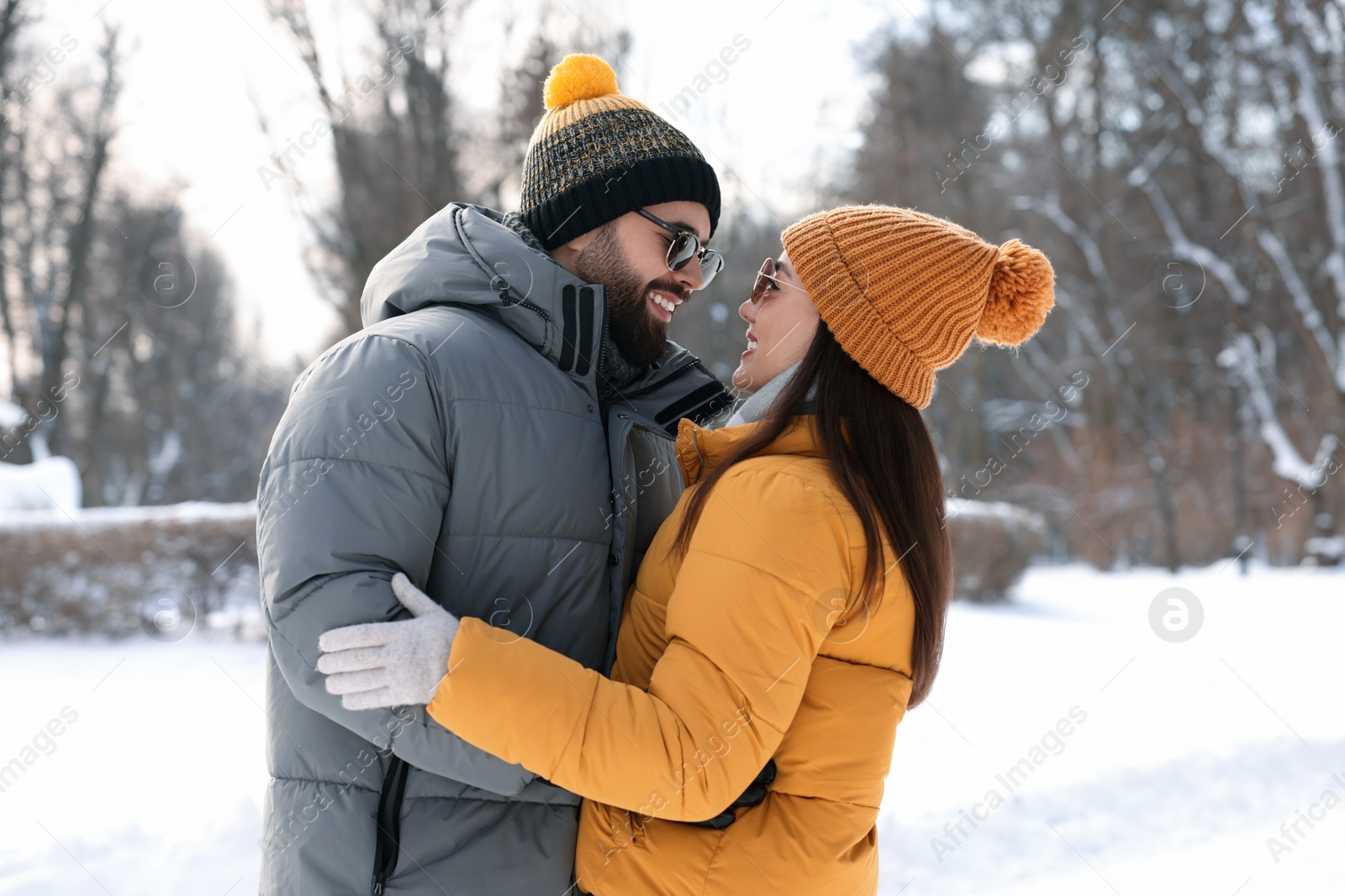 Photo of Beautiful happy couple spending time together on winter day