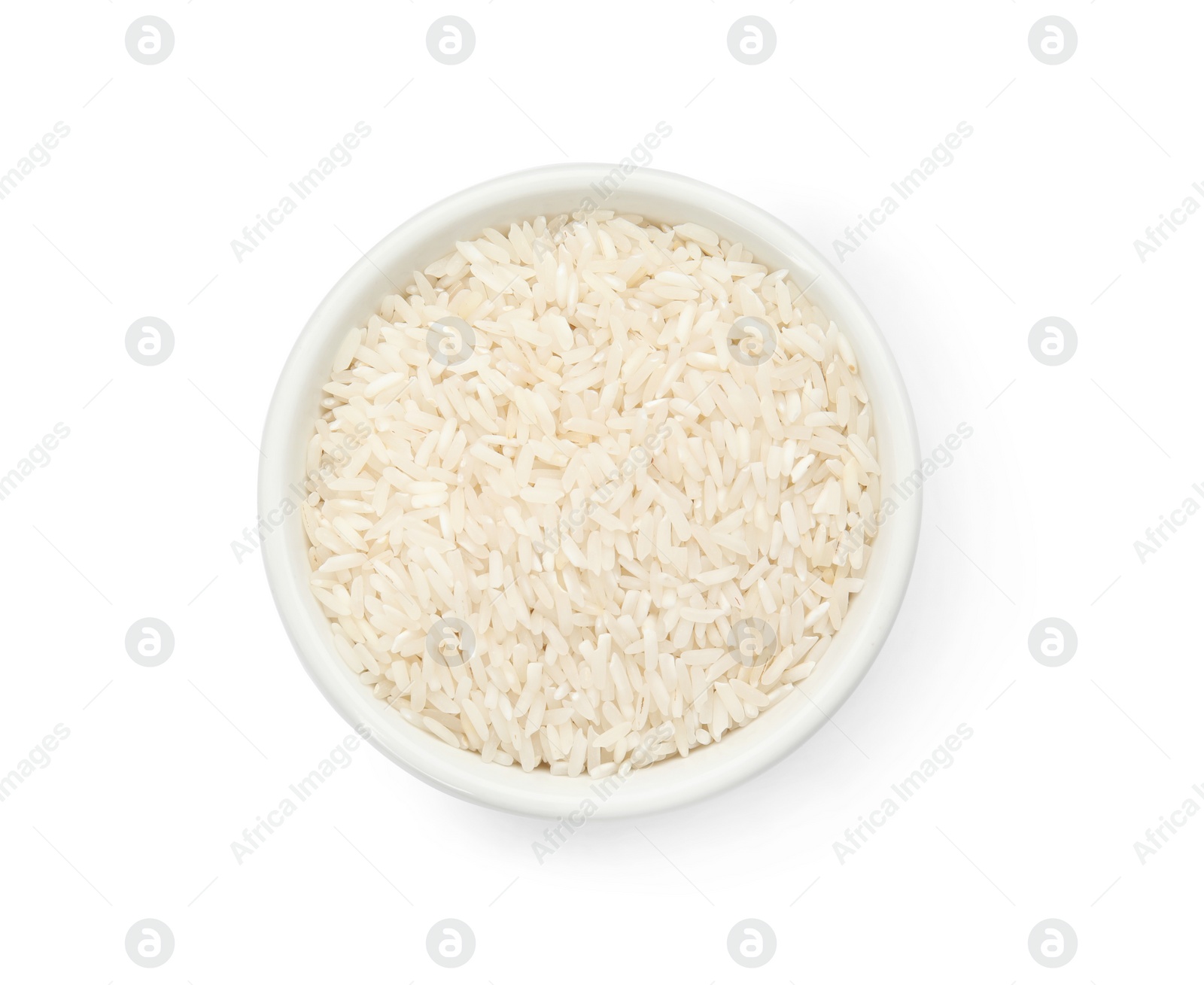 Photo of Bowl with uncooked rice on white background, top view