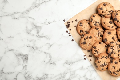 Flat lay composition with chocolate cookies and space for text on marble background