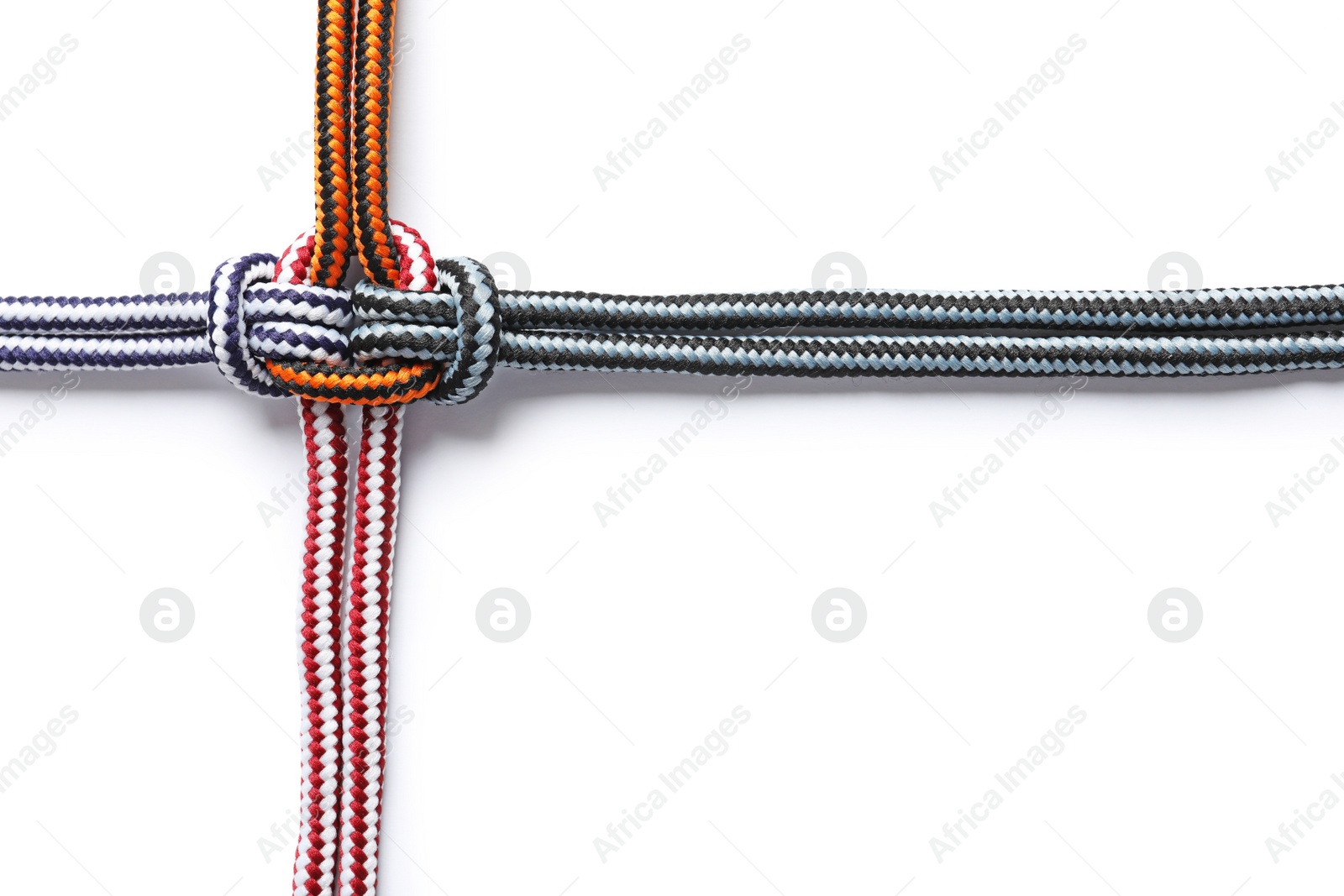Photo of Colorful ropes tied together on white background. Unity concept