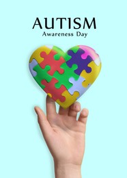 Image of World Autism Awareness Day. Heart made of colorful puzzle pieces and woman on light blue background, closeup