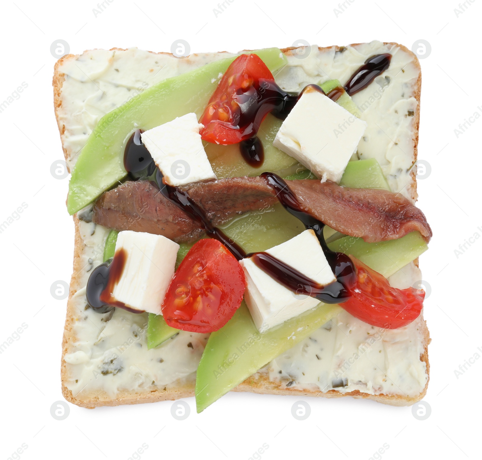 Photo of Delicious sandwich with anchovy, cheese, tomato and sauce on white background, top view